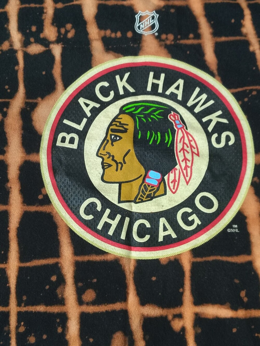 Reebok Blackhawks Graphic Tee — Black & Orange Grid Bleach